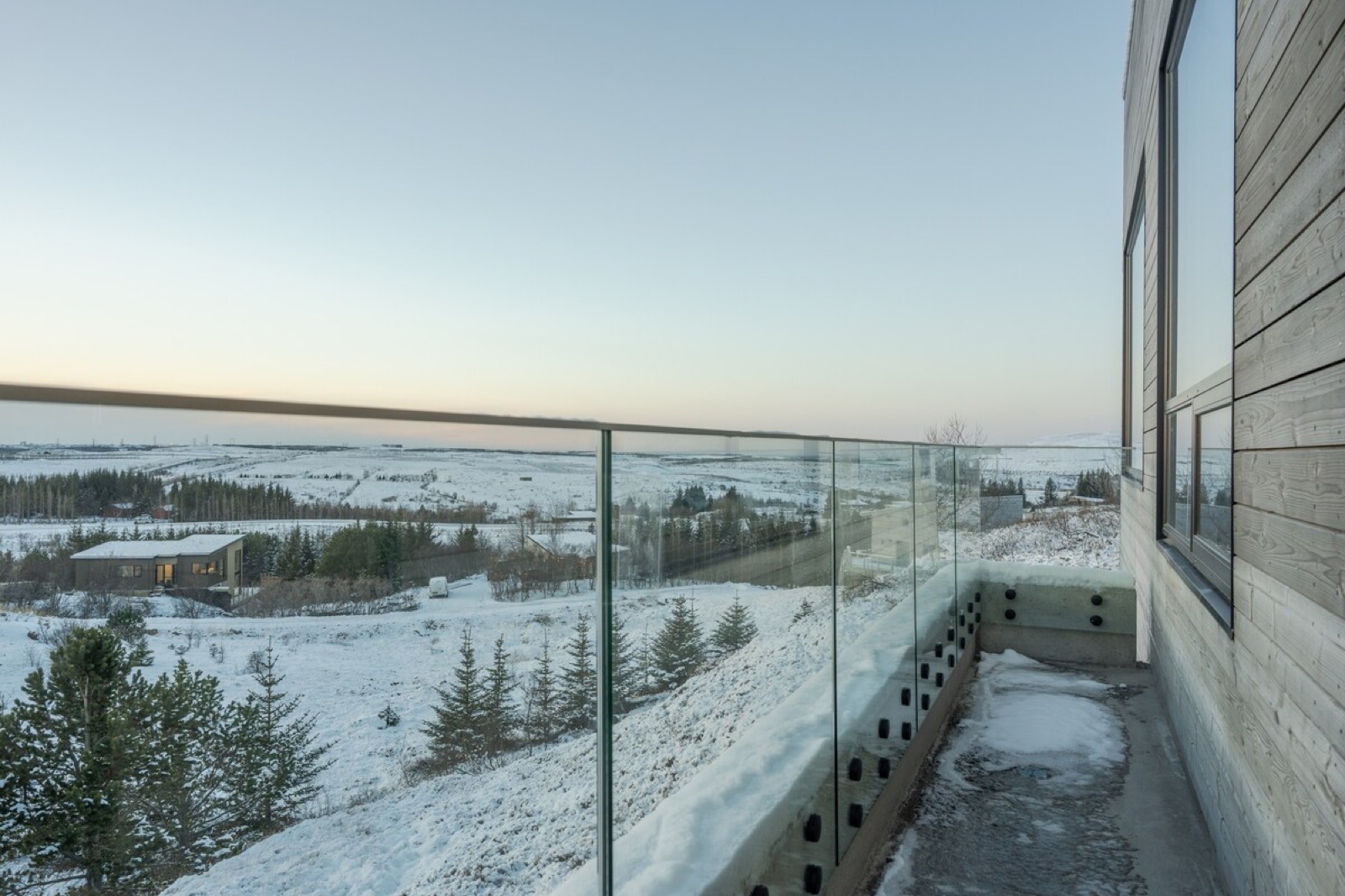 The glass balustrade terrace looking out over the snow covered heath